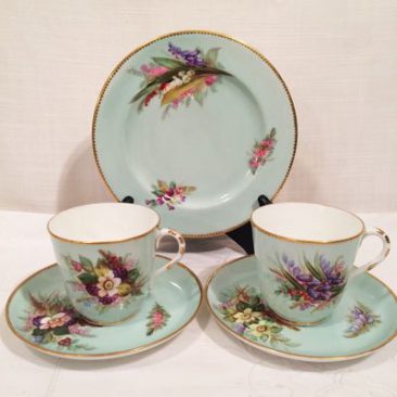 Four Royal Worcester cups and saucers and cake plates