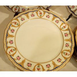 Close-up of one of the set of fourteen William Guerin Limoges dinner plates, in Sevres style decoration