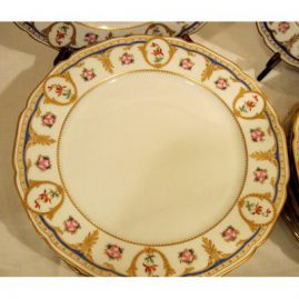 Close-up of one of the set of fourteen William Guerin Limoges dinner plates, in Sevres style decoration