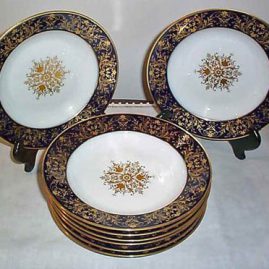 Seven Sevres cobalt with raised gilding wide rim soups