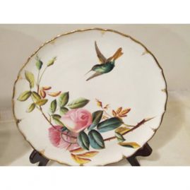 Close up of one of the set of eight George Jones rose and hummingbird plates.