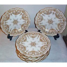 12 Royal Crown Derby plates with profuse gilding