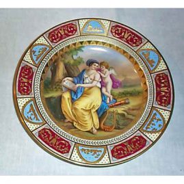 Royal Vienna plate of lady and cherub, underglaze blue beehive mark