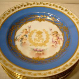 Set of eight Louis Philippe Sevres wide rim soups with cherub