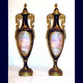 Back of a pair of cobalt and gold "Sevres" urns, with lovers on the other side