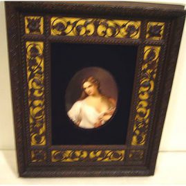 Porcelain plaque in beautiful carved wood frame