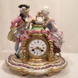 Picture of French figural clock without dome and base with bisque and porcelain figures of man and woman