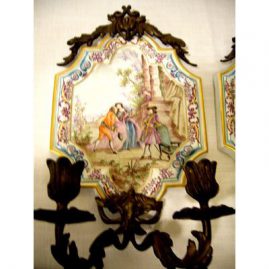 The other of a rare pair of antique French Faience Lille sconces, with scenes of lovers