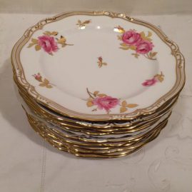 Set of eleven Spode made for Tiffany fluted dessert plates with beautiful pink roses with a white back ground