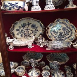 Showcase showing a selection of Meissen blue onion china