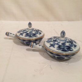 Meissen blue onion sauciers or pot de cremes with gilded border
