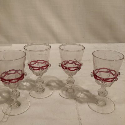 Set of five Salviati Venetian cordials with applied pink ribbon and raised crystal balls