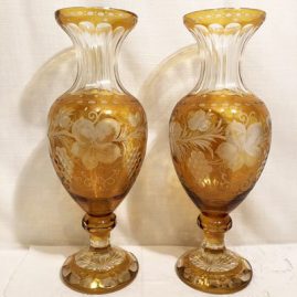 Pair of tall gold Bohemia Czechoslavakia overlay wheel cut vases.