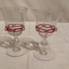 Pair of Salviati Venetian goblets with raised pink ribbon glass decoration and applied crystal balls