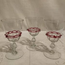 Set of eight Salviati Venetian White wines with raised pink ribbon glass decoration and applied crystal balls