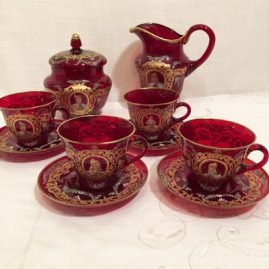 Venetian set with each piece with a different painted portrait