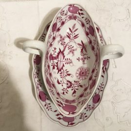 Rare pink onion gravy with attached under plate