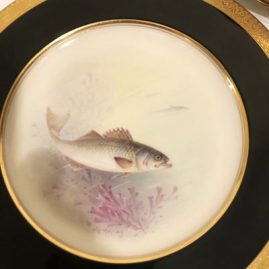 Close up of one of the eleven Lenox artist signed W. H. Morley fish plates