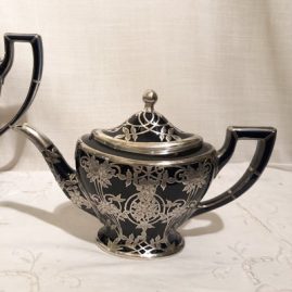 This is a close up of the teapot from the previous silver overlay set