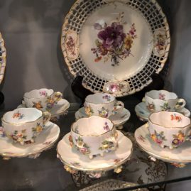 Set of six Meissen cups and saucers with raised flowers