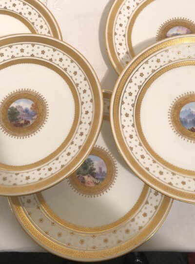Set of eight English Minton luncheon or dessert plates with miniature paintings