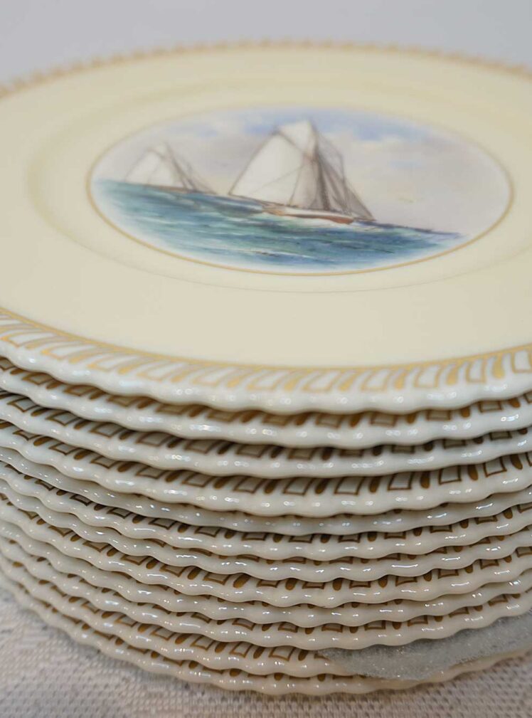 Set of 12 Lenox dinner plates each painted with a different sailing ship from the Americas Cup