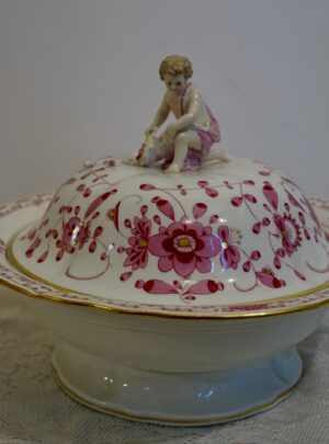 Meissen Purple Indian Covered Gravy with a Figure of a Putti and Cornucopia on Top