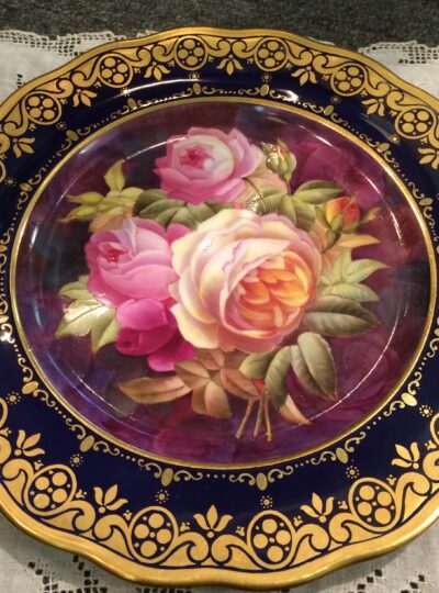 Set of 12 Cauldon cobalt plates with exceptionally painted bouquets
