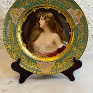Cabinet portrait plate that has a central painting of a beautiful lady with long flowing hair.