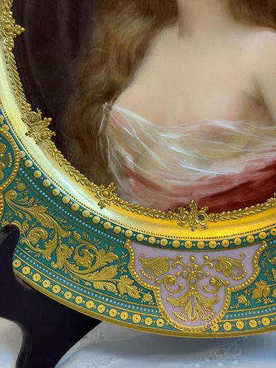 abinet portrait plate that has a central painting of a beautiful lady with long flowing hair abinet portrait plate that has a central painting of a beautiful lady with long flowing hair