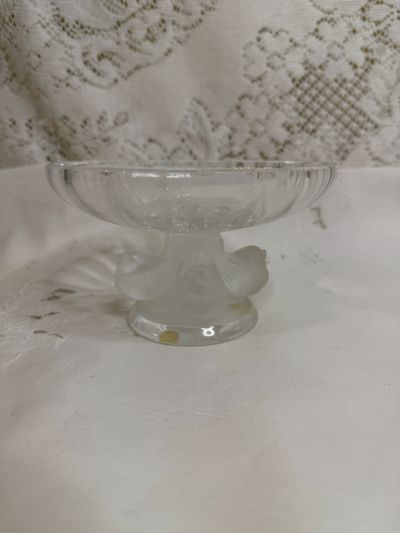 Lalique compote with four iridescent figural birds around its base and a clear glass compote top Lalique compote with four iridescent figural birds around its base and a clear glass compote top