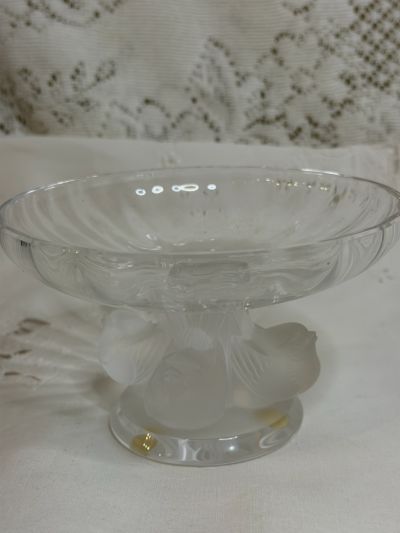 Lalique compote with four Iridescent figural birds around its base and a clear glass compote top Lalique compote with four Iridescent figural birds around its base and a clear glass compote top