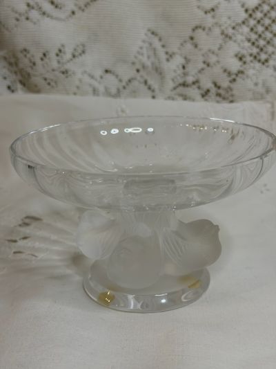 Lalique compote with four Iridescent figural birds around its base and a clear glass compote top Lalique compote with four Iridescent figural birds around its base and a clear glass compote top
