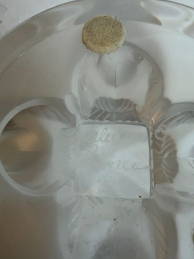 Lalique compote with four iridescent figural birds around its base and a clear glass compote top Lalique compote with four iridescent figural birds around its base and a clear glass compote top