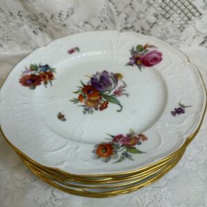 Set of 8 KPM plates each painted with a different flower bouquet