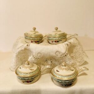 set of seven KPM pot de cremes each hand-painted differently with butterflies and flowers