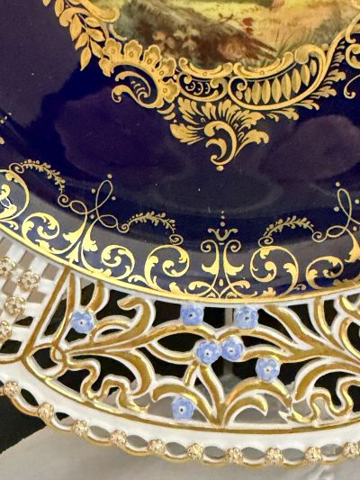 Meissen cobalt cabinet plate with an intricate reticulated border decorated with raised gold and blue forget-me-nots Meissen cobalt cabinet plate with an intricate reticulated border decorated with raised gold and blue forget-me-nots