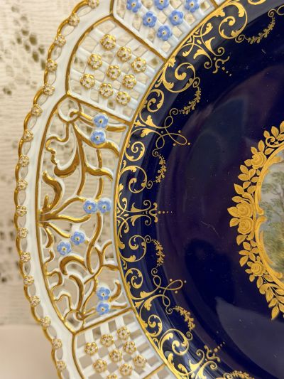 Meissen cobalt cabinet plate with an intricate reticulated border decorated with raised gold and blue forget-me-nots Meissen cobalt cabinet plate with an intricate reticulated border decorated with raised gold and blue forget-me-nots