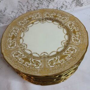 Set of Twelve Royal Doulton Dinner Plates that have Raised Profuse Gilding on a White Background