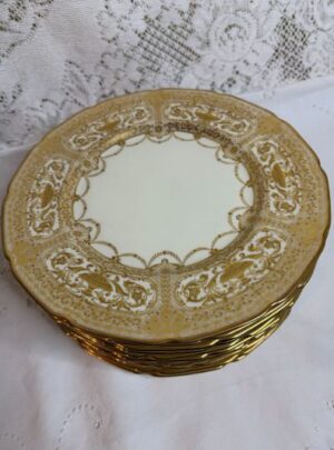 Set of Twelve Royal Doulton Dinner Plates that have Raised Profuse Gilding on a White Background