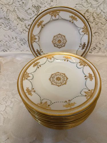 set of 11 Copeland Spode dessert plates which have a border of garlands of aqua enamel jewels and gold bows set of 11 Copeland Spode dessert plates which have a border of garlands of aqua enamel jewels and gold bows
