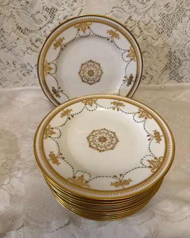 set of 11 Copeland Spode dessert plates which have a border of garlands of aqua enamel jewels and gold bows set of 11 Copeland Spode dessert plates which have a border of garlands of aqua enamel jewels and gold bows