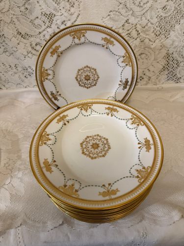 set of 11 Copeland Spode dessert plates which have a border of garlands of aqua enamel jewels and gold bows set of 11 Copeland Spode dessert plates which have a border of garlands of aqua enamel jewels and gold bows