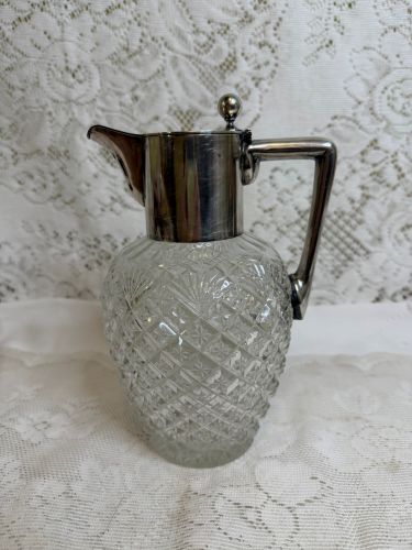 Brilliant Cut Glass Pitcher with a Silver Fitted Cover