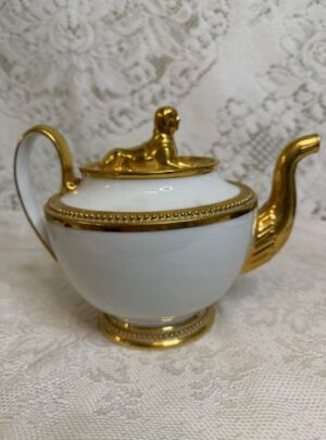Rare white Paris Porcelain teapot that has a gold figural Sphinx on its cover