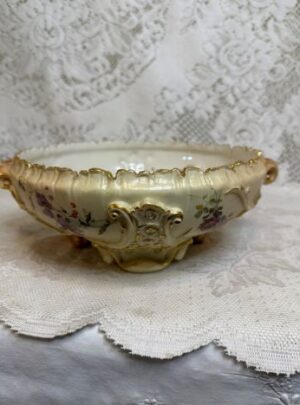 Royal Worcester bowl with a fluted rim and flowing arabesque like handles and feet