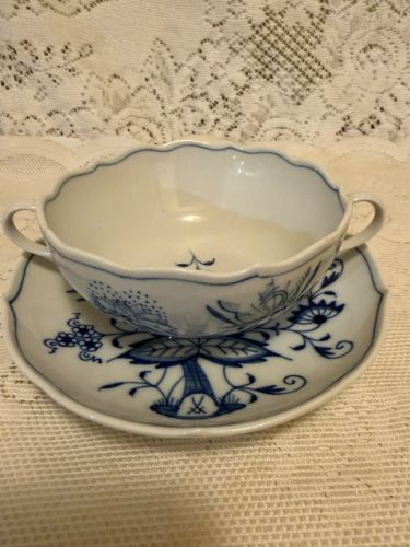 Set of eight rare cream soup bowls and saucers each having two handles. Set of eight rare cream soup bowls and saucers each having two handles.