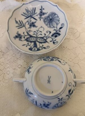 Set of eight rare cream soup bowls and saucers each having two handles.